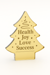 Decorative Christmas tree-shaped acrylic plaque engraved with “Health, Joy, Love, Success” and minimalist festive graphics – So Cute Cut corporate gift.

