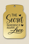 Χρυσό ταμπελάκι σε σχήμα βάζου με χάραξη “The Secret Ingredient is Always Love” – So Cute Cut rustic charm

