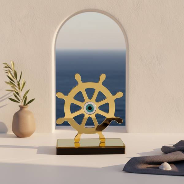 Decorative ship's wheel with a mirror reflecting ocean view on a shelf.