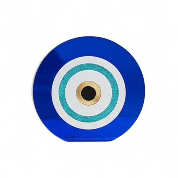 Επιτραπέζιο γούρι μάτι από μπλε και λευκό plexiglass με τιρκουάζ glitter λεπτομέρεια και χρυσό κέντρο σε λευκό φόντο.