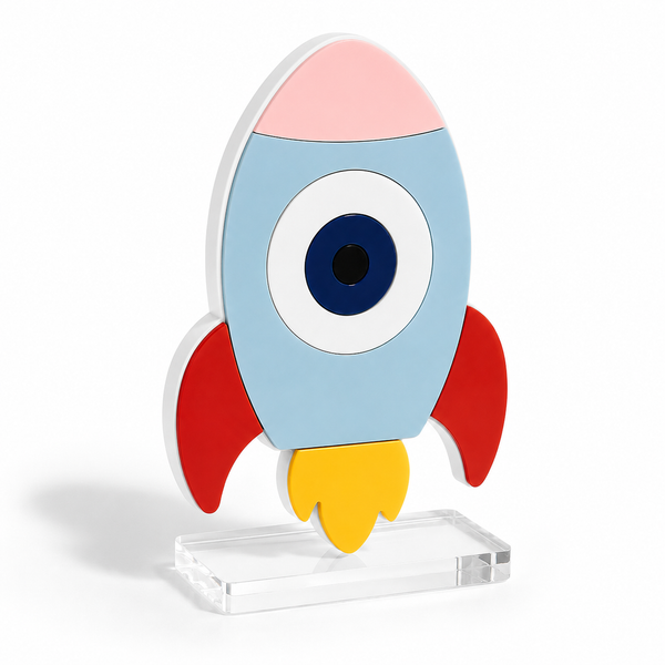 Αυτοστηριζόμενο διακοσμητικό Rocket Eye από πλεξιγκλάς με λευκή πλάτη, πολύχρωμα επίπεδα και διάφανη βάση για θεματική βάπτιση Διάστημα.
