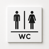 Modern engraved WC restroom sign made from two-layer acrylic by So Cute Cut