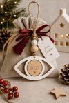 Ιδέα  χρήσης ξύλινου laser cut πλαίσιου σε σχήμα ματιού από MDF για προσωποποίηση και DIY κατασκευές, κατάλληλο για λαμπάδες, γούρια και μπομπονιέρες – So Cute Cut.