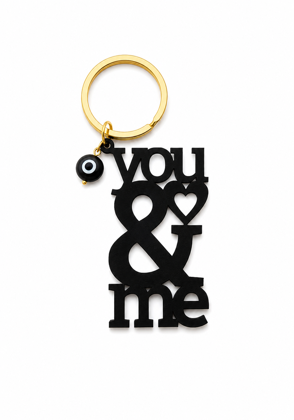 Χειροποίητο πλεξιγκλάς μπρελόκ You & Me με κρεμαστό ματάκι και χρυσό κρίκο σε μαύρο χρώμα